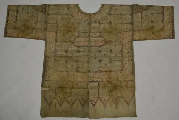 Textile, talismanic shirt, inscribed and painted cotton, with ink and gold paint, probably India, ca