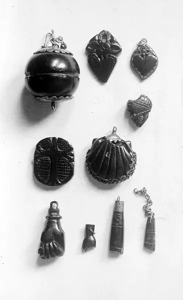 Jet bead, heart forms, St. James shell.