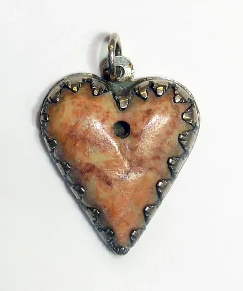 Heart-shaped pink stone amulet ( Schreckstein ) in a silver mount, Vienna (Austria), 1700-1799