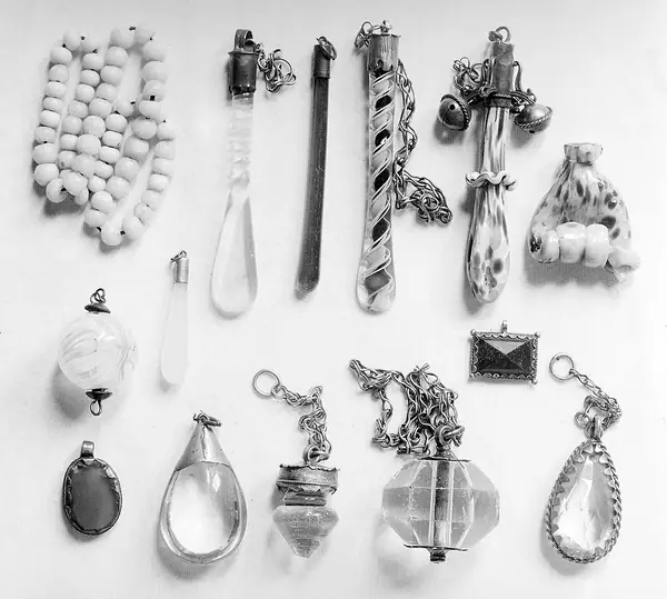 Glass, milky beads, fig-hands and beads.