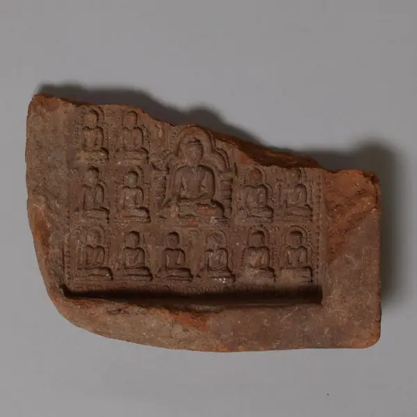 Fragment of a votive tablet showing Buddhas, terracotta, from the Kyaukku Ohnmin Temple at Pagan, Burma, 11th 