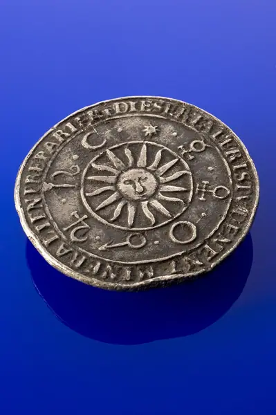 Metal amulet with symbols of the 7 planets on one side, insc