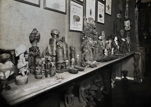 Wellcome Historical Medical Museum, Wigmore Street, London: a display of figurines and fetishes. Photograph from a negative of 1913.