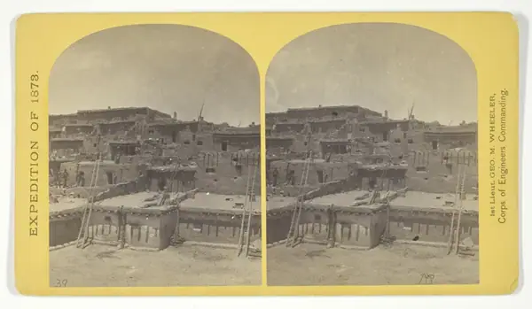 Indian Pueblo of Zuni, New Mexico; view from the interior. The "Pueblo" or town, encloses a quadrangular area within which are the ruins of a church built under the direction of the Jesuit missionaries. The houses are built one above the other to the height of five or six stories. The entrances are mostly from the top, the ascent and descent being made by ladders, No. 16 from the series "Geographi