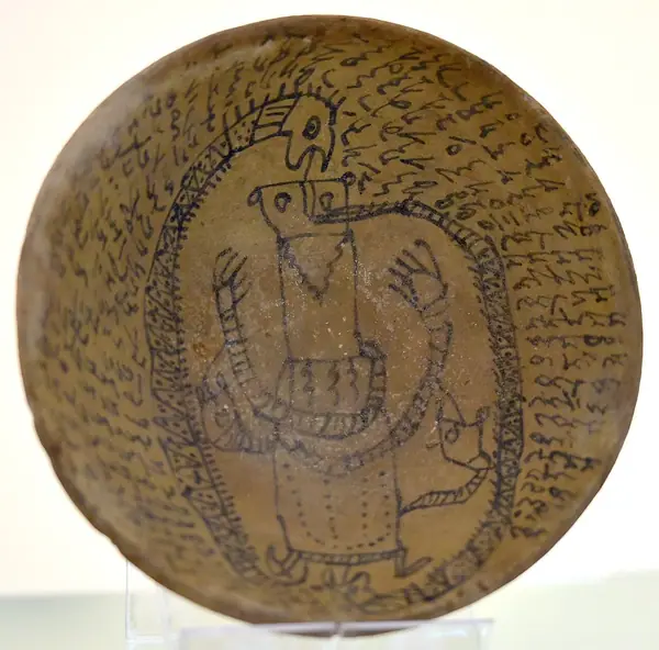 Incantation bowl, from Iraq, Aramaic inscription with a human figure and snakes. 3rd to 7th century CE. Iraq Museum