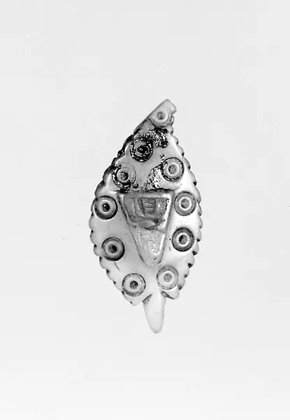 Pendant of ivory of Madonna and Child.