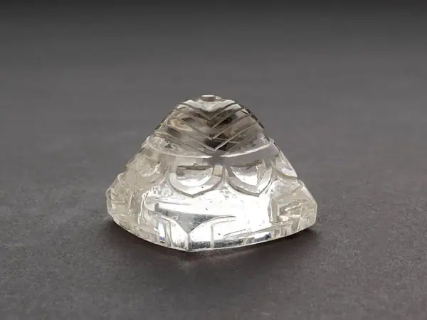 A charm of unusual form, representing a "Yantra", carved and polished rock crystal, Nepal, early 19th century