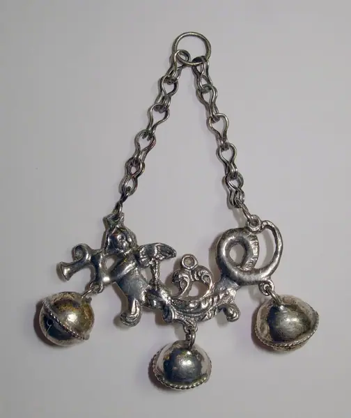 Silver amulet for a child ( sonajero ), shaped like a winged siren with bells, Cordoba (Spain), 1750-1850