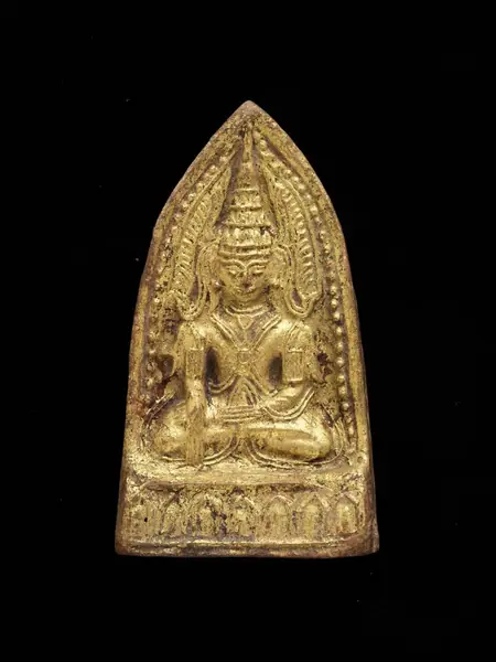 A 1700-1800 terracotta votive plaque of a seated Buddha that was moulded in low relief