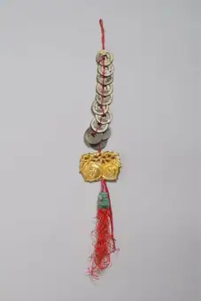 Wedding charm, coins threaded on red silk cord with tassel, Hong Kong, 1950-1990