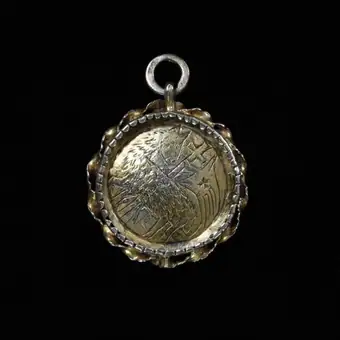 Pendant, silver-gilt, depicting the Agnus Dei . Possibly German, 1400-1450