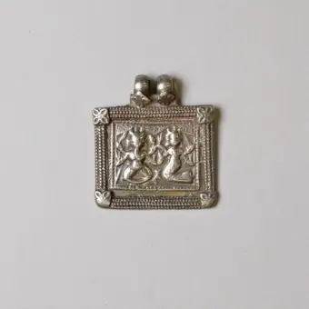 Silver amulet die-stamped with figures of Ganesh and Parvati
