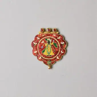 Enamelled amulet depicting Shrinathji from Rajasthan