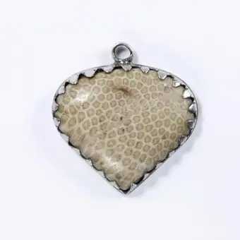 Heart-shaped amulet of fossilised coral (Krätzenstein) in a silver mount, Bavaria (South Germany), about 1800