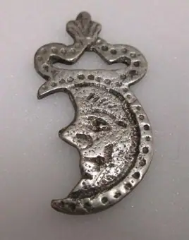 Silver amulet shaped like a crescent moon with a human face, Naples (Italy), 1800-1899
