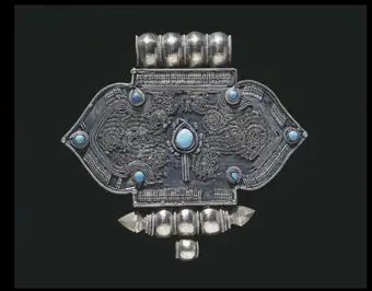 This is currently labelled LOST.1301 NEEDS RENUMBERING; pendant; Ritual, silver brass turquoise, filigree, Tib