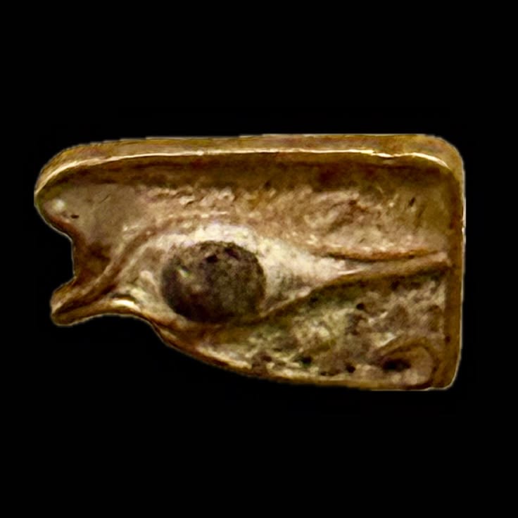 A gold and enamel wedjat, Faras, Nubia
