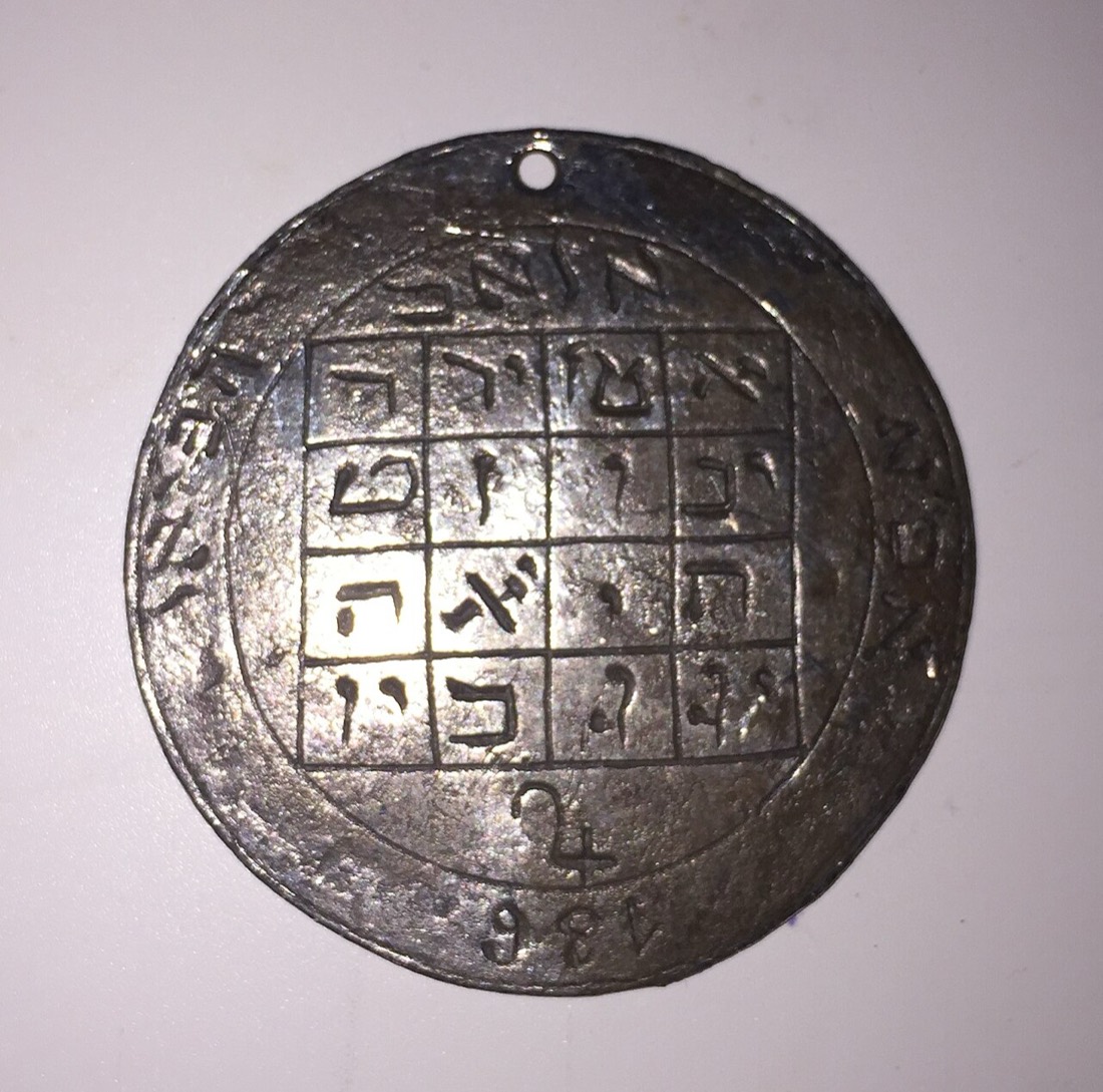 A silver disc with a magic square