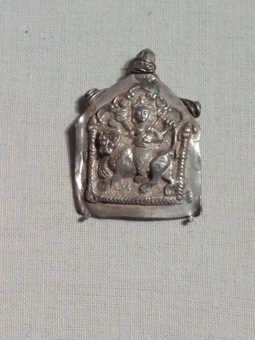 An amulet with Durga