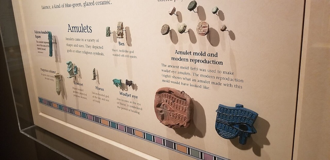 A museum case of amulets