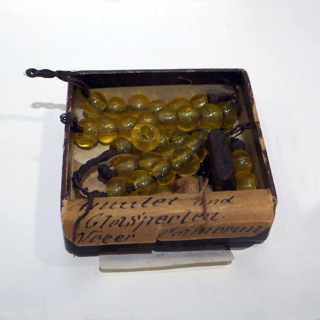 Amulet and glass beads, Museum im Ritterhaus